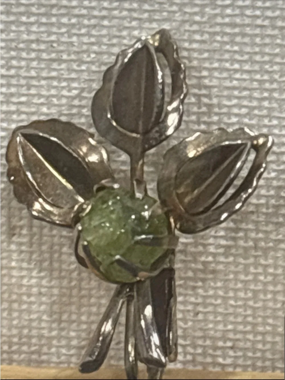 Gold tone leaf clip on earrings with natural peridot gemstone